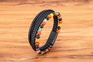 Detailed macro view of leather braided cord and natural tiger eye stone beads on the bracelet