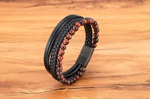 Detailed close-up of multilayer leather bracelet with tiger eye beads and magnetic clasp