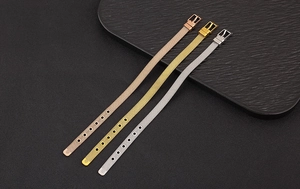 Detailed macro view of adjustable stainless steel mesh bracelets in gold, silver, and rose gold