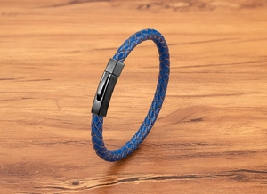 Close-up of blue braided leather bracelet with black brushed metal hexagonal clasp