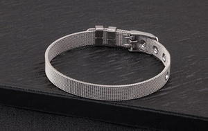 Macro view of adjustable silver stainless steel Milanese mesh bracelet with buckle