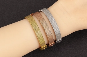 Milanese mesh bracelets in gold, rose gold and silver finish on person's wrist