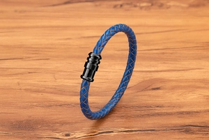 Close-up of blue braided leather cord with a black magnetic stainless steel clasp detail