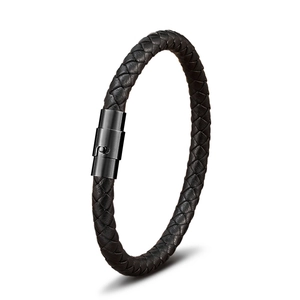 Detailed view of black braided leather bracelet with magnetic stainless steel clasp