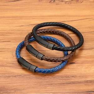 Three braided leather bracelets in black, brown, and blue with matte hexagon buckles
