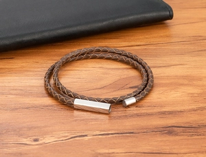 Detail view of the brown leather braided double-wrap bracelet with magnetic steel clasp