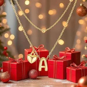 Elegant gold double-layer necklace set with heart and letter A pendants on red gift boxes
