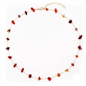 Adjustable golden link necklace with irregular red agate gemstones on a white background