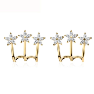 Macro shot of elegant triple-flower earrings featuring marquise-cut white zircons in gold
