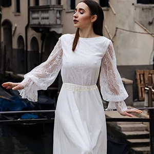 Elegant white lace long sleeve dress with puff sleeves and waist sequin detail in European town