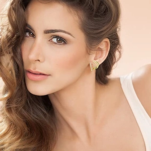 Detail of luxury gold multi-layer curved claw earrings with sparkling zircon inlay