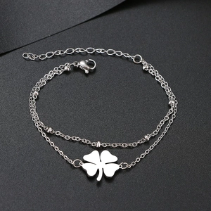 Klassisches silbernes Edelstahl Doppelarmband mit einem hohlen vierblättrigen Kleeblatt
