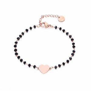 Rose gold stainless steel bracelet featuring black faceted beads and a heart pendant