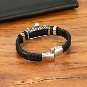 Men's black braided leather bracelet with skull wing motif and magnetic steel clasp