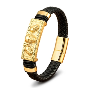 Men's punk braided leather bracelet with golden skull motif and magnetic clasp