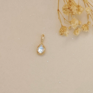 Exquisite teardrop moonstone pendant with blue glow and vintage gold embossed frame
