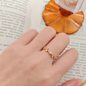 Gold vine leaf ring with natural Australian opal and sparkling small accent diamonds