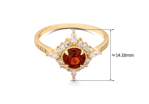 Detailed macro view of 925 silver vintage ring with red zircon and 14.18mm floral setting