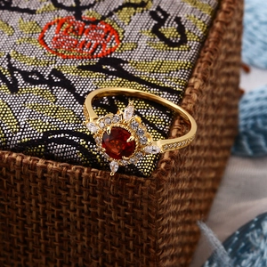 Luxurious 925 silver gold-plated ring with red garnet stone and zircon pavé floral design
