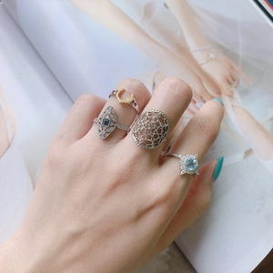 Stackable 925 silver rings with horseshoe design and blue gemstone in 14K gold finish