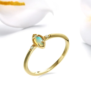 Macro shot of gold-plated S925 silver ring featuring marquise opal stone and side zircons