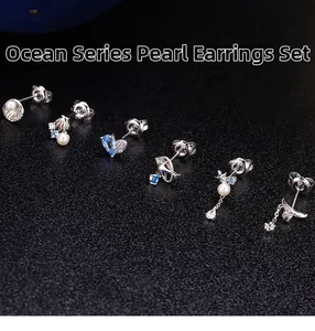 Detalle del juego de 6 pendientes temáticos del mar en plata S925 con perlas y cristales