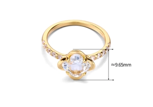 Macro view of 925 silver gold ring featuring a 9.65mm blue topaz clover main stone