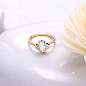 Macro detail of S925 stamp on a gold plated silver ring with blue clover gemstone