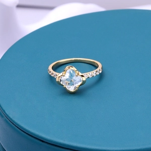 Elegant S925 silver gold-plated ring with clover-shaped gemstone and side crystals