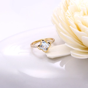 Detailed macro view of S925 engraved stamp inside gold ring with blue clover gemstone