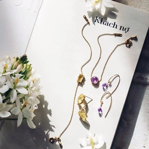 Elegant 14K gold jewelry set featuring natural amethyst and yellow gemstone accents