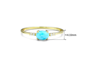 Macro shot of oval blue larimar ring with zircon accents and S925 hallmark engraving