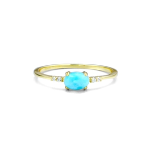 Detailed macro of S925 engraved gold ring with blue larimar stone and side zircons
