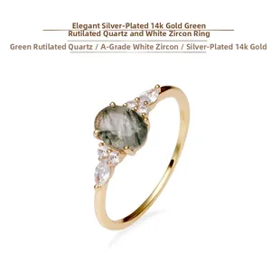 Detail shot of S925 stamp on a gold-plated ring with green rutilated quartz and zircon