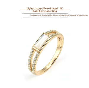 Close-up of S925 sterling silver 14K gold plated ring with white shell and zircons