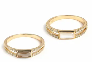 Detailed macro shot of S925 sterling silver gold-plated rings with smoky quartz and white shell