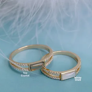 Detailed shot of S925 gold plated rings featuring smoky quartz and white mother-of-pearl