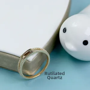 Macro view of gold plated ring with smoky quartz and pave-set cubic zirconia accents