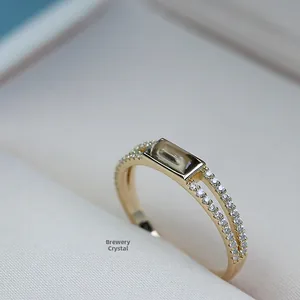 Detailed close-up of 18k gold-plated ring featuring rectangular smoky quartz stone