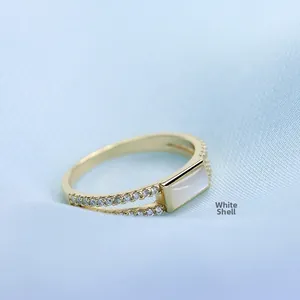 Detailed macro of S925 gold plated ring featuring white shell and zircon accents