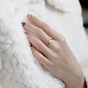 Detail of s925 gold-plated ring with rectangular white shell and pave-set diamonds