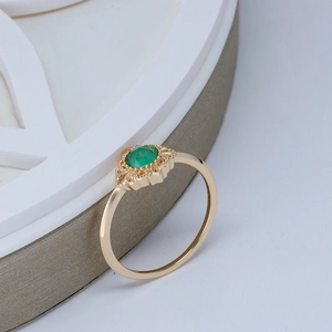 Close-up of a vintage 14K gold-plated silver ring with a green agate gemstone