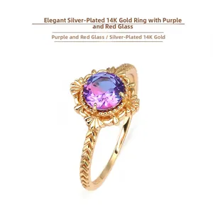 Macro detail of V-shaped engraved 14K gold plated silver band with bicolor zircon stone