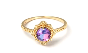 Detailed macro view of S925 sterling silver gold ring with color-changing zircon stone