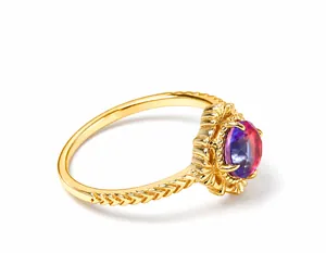 Macro detail of 925 silver ring featuring color-changing zircon and floral engraving
