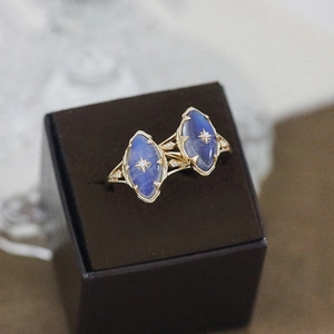 Vintage gold star ring with marquise labradorite stones in a velvet jewelry box