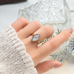 Detailed view of vintage gold ring with marquise labradorite and star engraving