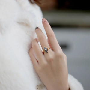 Detail of S925 gold-plated ring with marquise labradorite and star engraving
