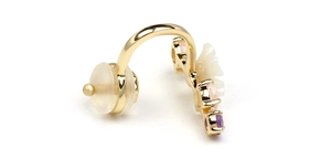 Detail of 925 silver gold-plated ear cuff with shell flower and purple pink crystals