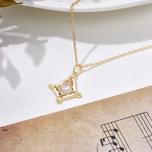 Elegant 18K gold-plated sterling silver kite pendant necklace with white crystal and opal